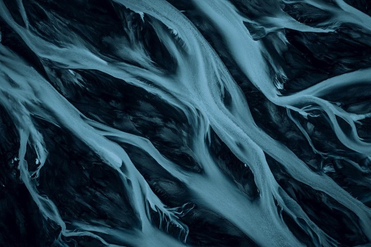 Dark and Abstract Aerial Photo of Glacial River