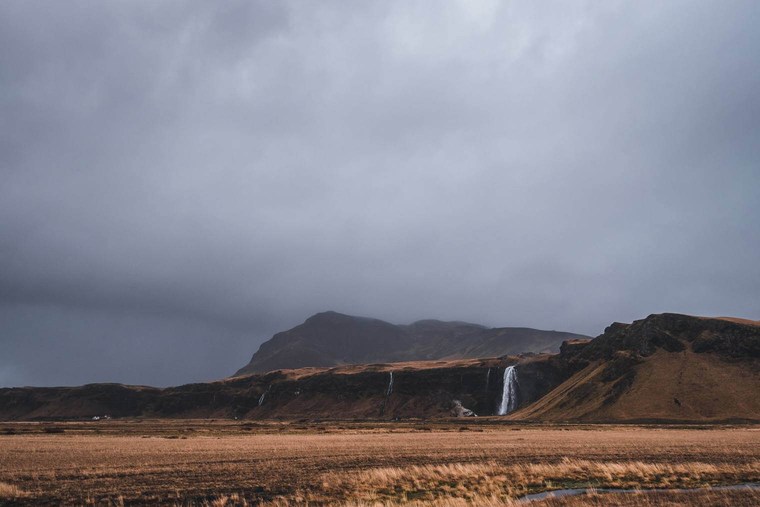 Dark and Moody Landscape with Waterfall