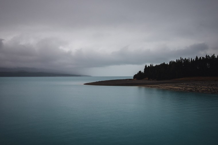 Dark and Moody Lake with Forest