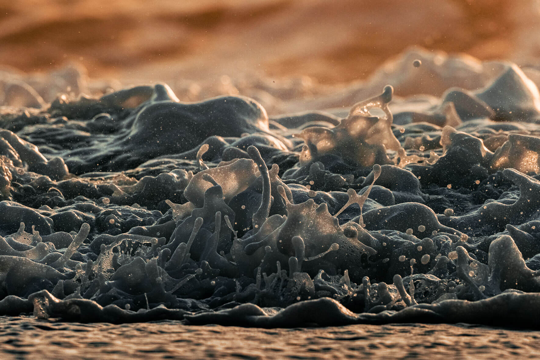 Close-up of Splashing Waves on Black Sand Beach of Vík, Iceland