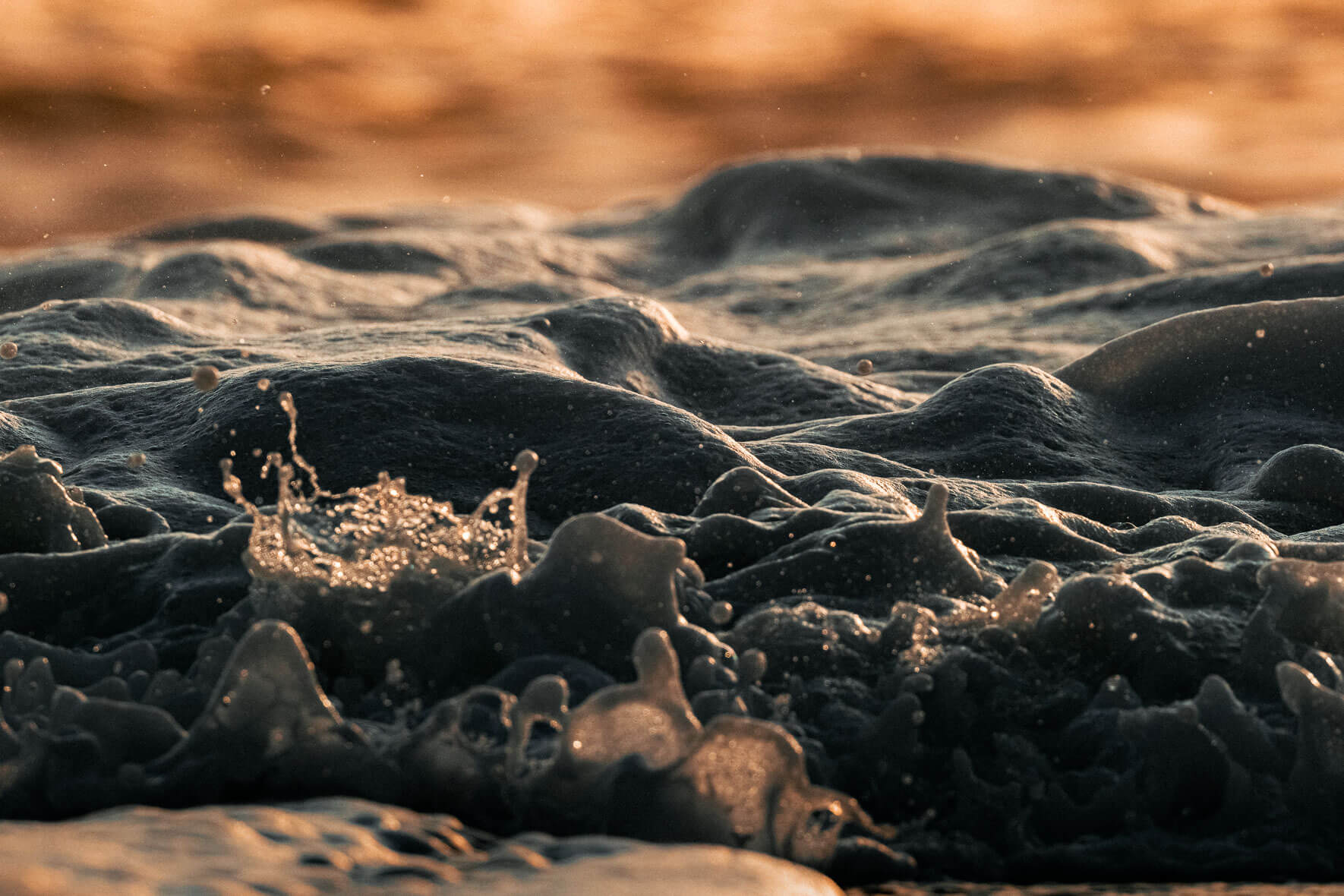Close-ups of Waves on Black Sand Beach of Vík in Iceland