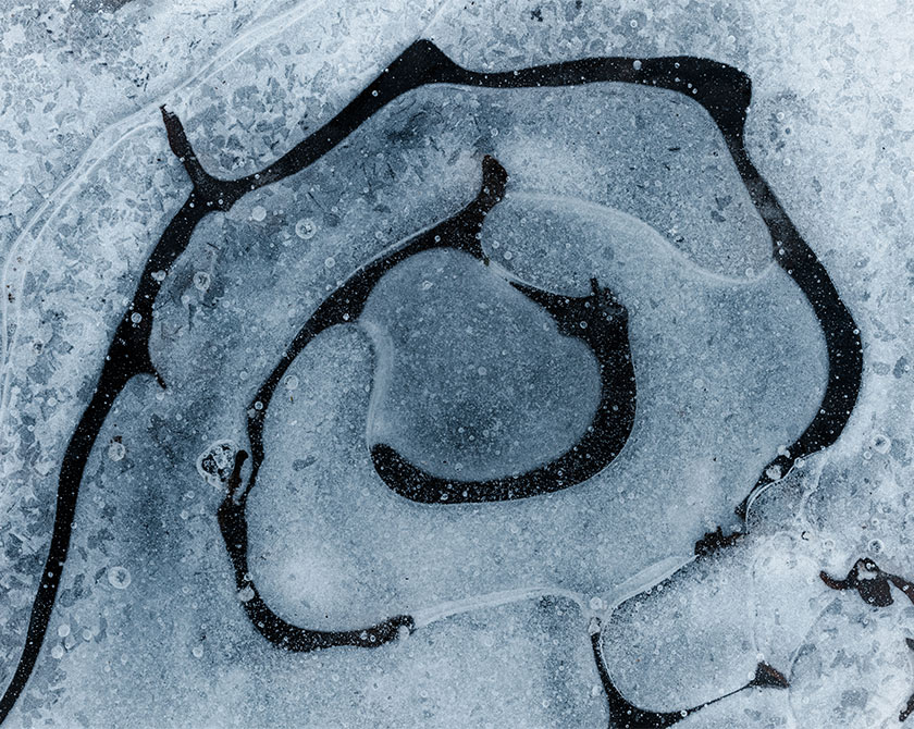 Winter Macro Photography of Frozen Puddle