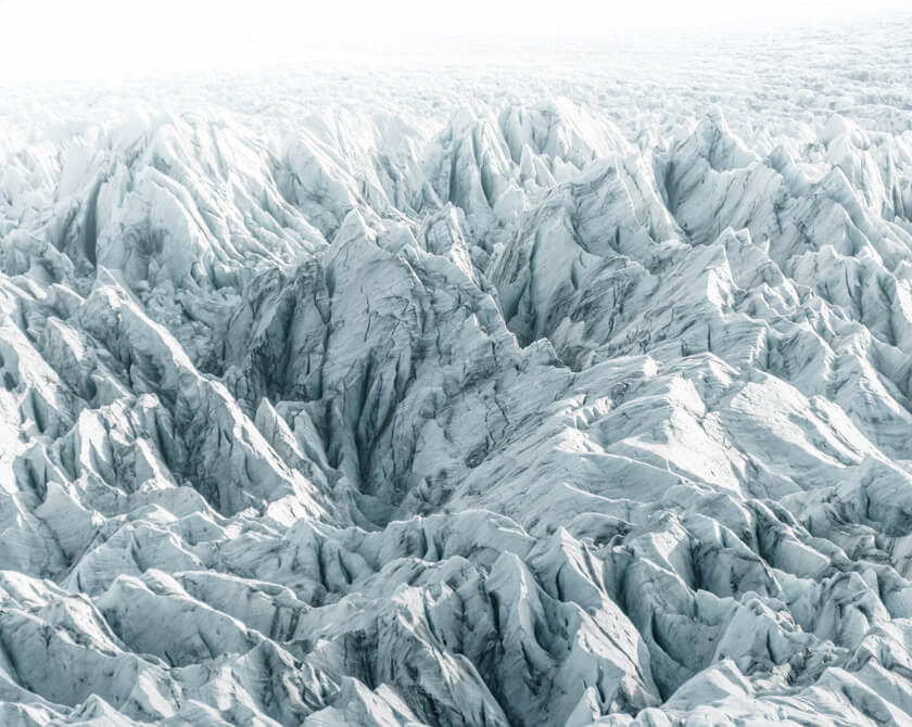 Fjallsárlón glacier in Iceland in glistening bright sunlight and almost monochrome colors