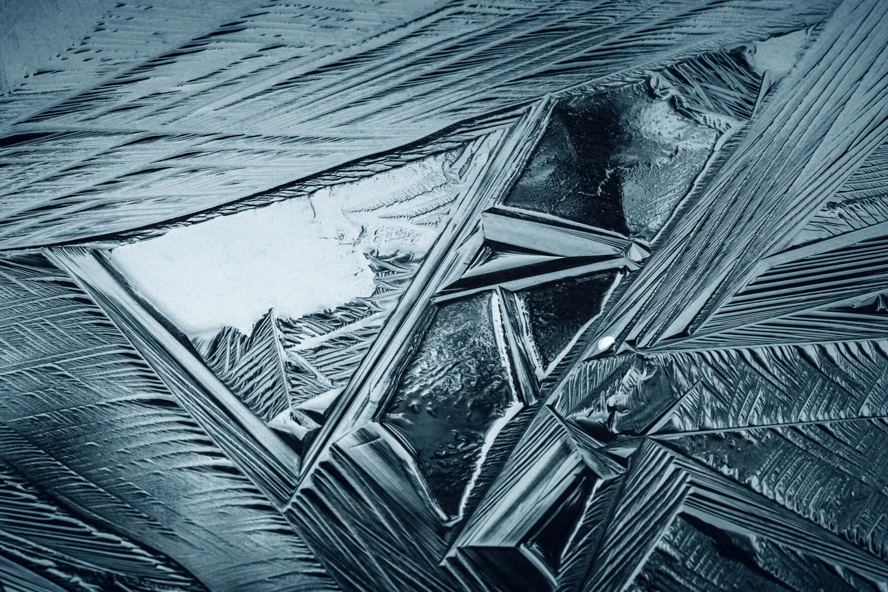 Abstract textures in the surface of a frozen lake