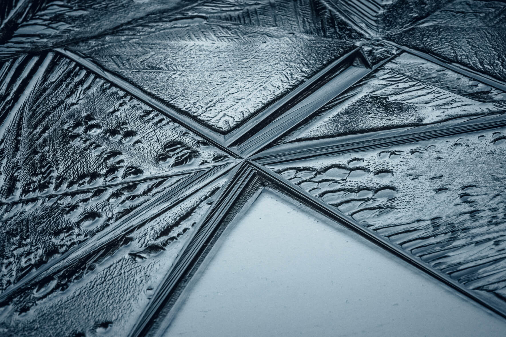 Abstract textures in the surface of a frozen pond at lake Eibsee