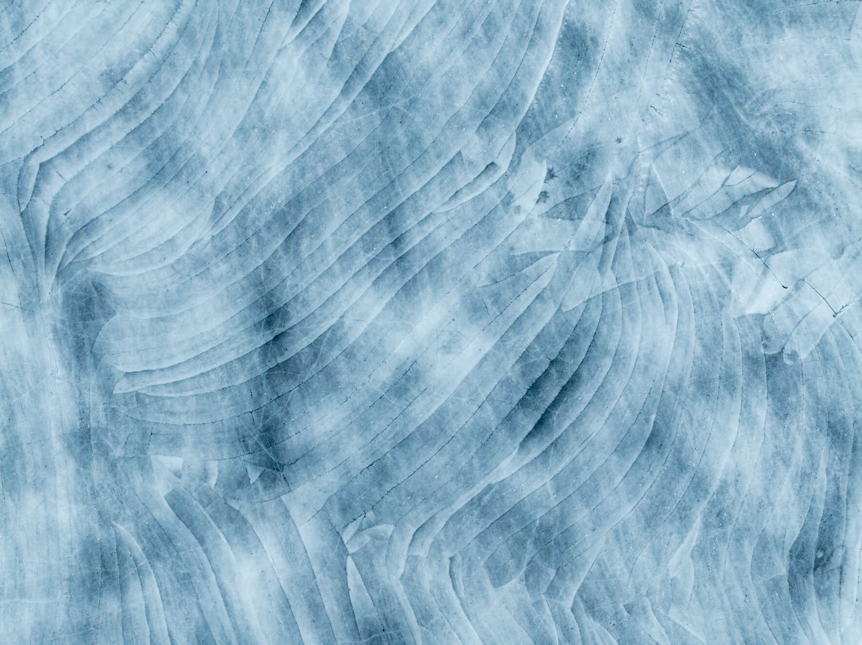 Aerial winter view of snow-covered ice ridges on a frozen lake