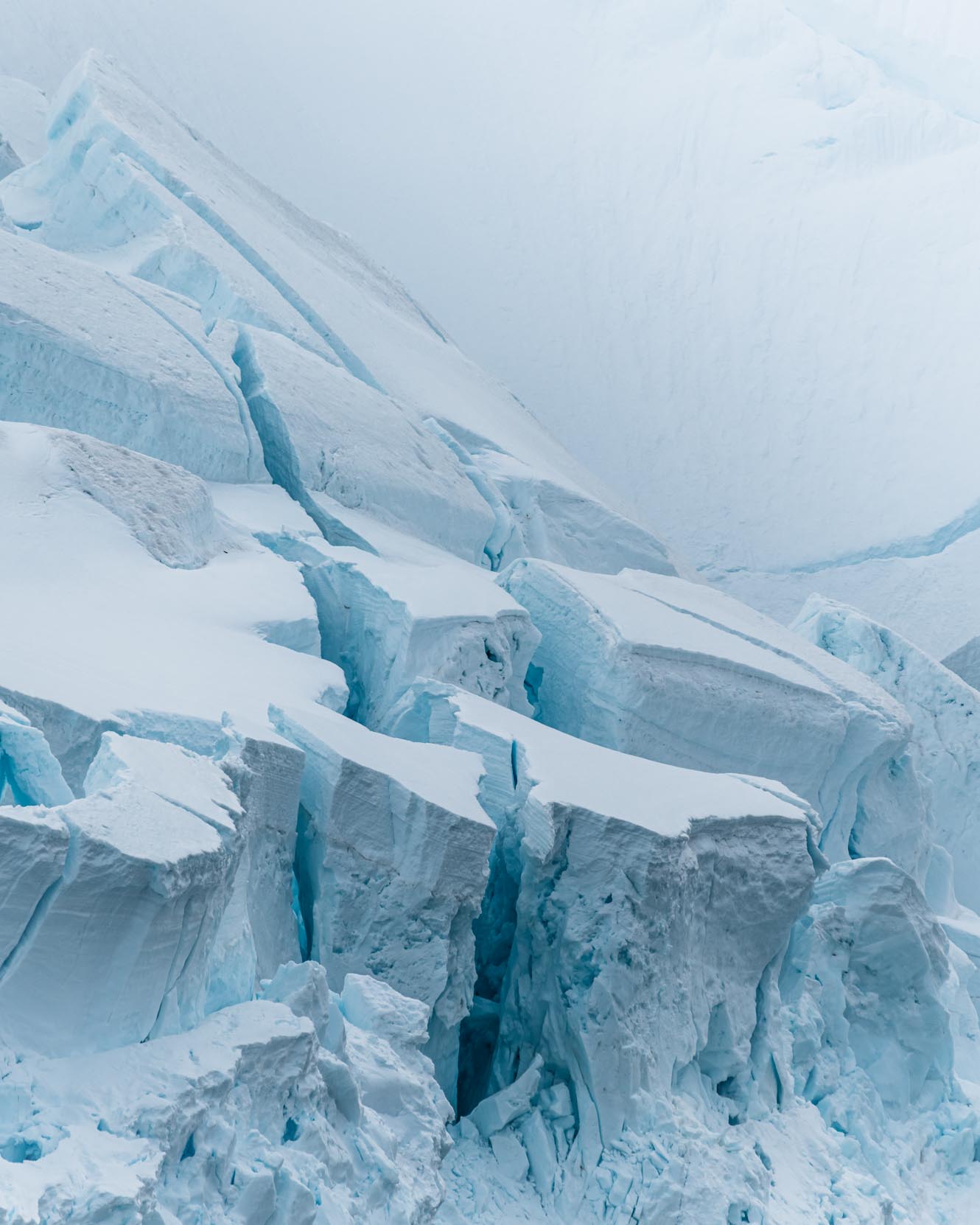 Glacier towers on the Antarctic Peninsula in snowy weather