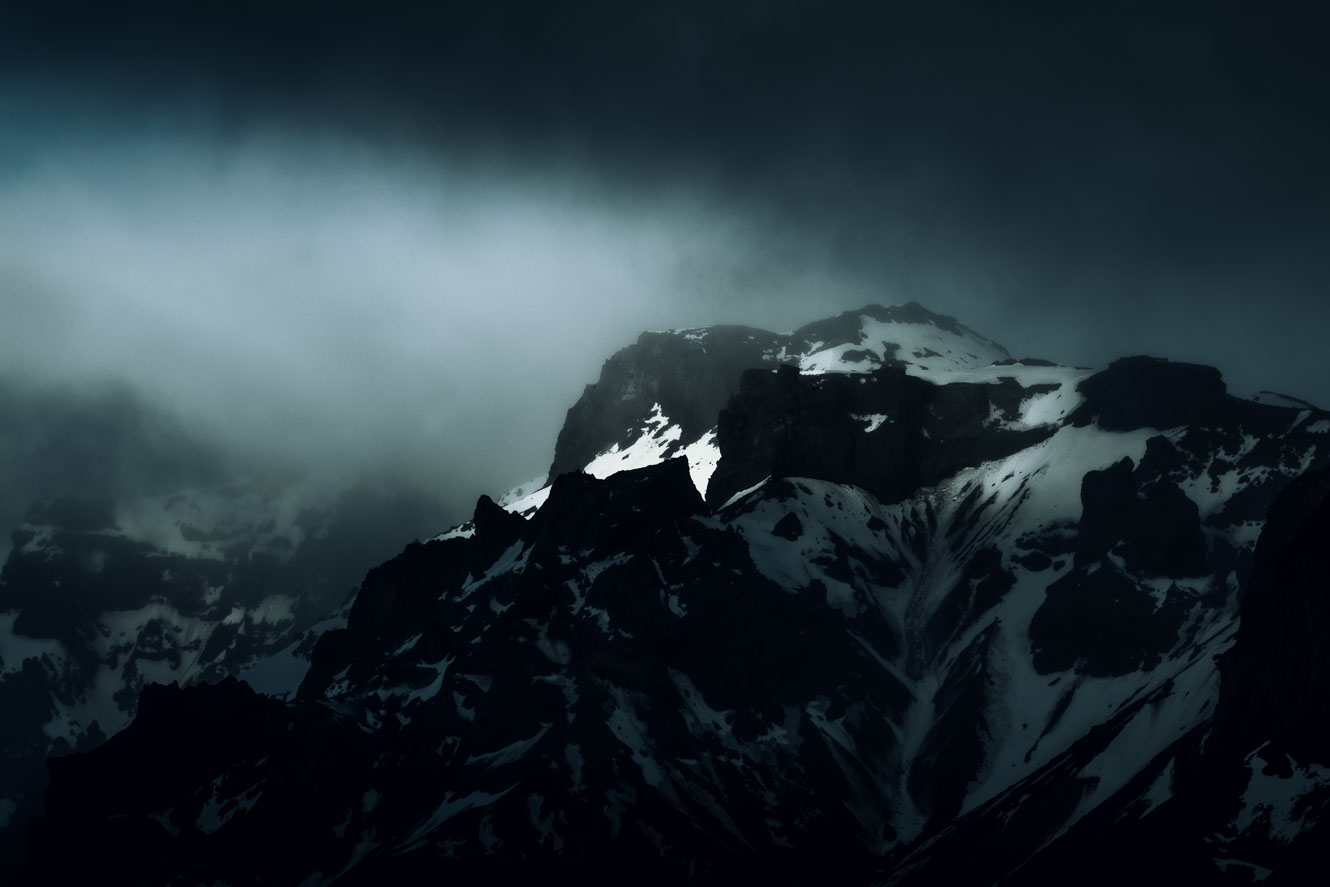 Dark and dramatic light over mountain range in Iceland