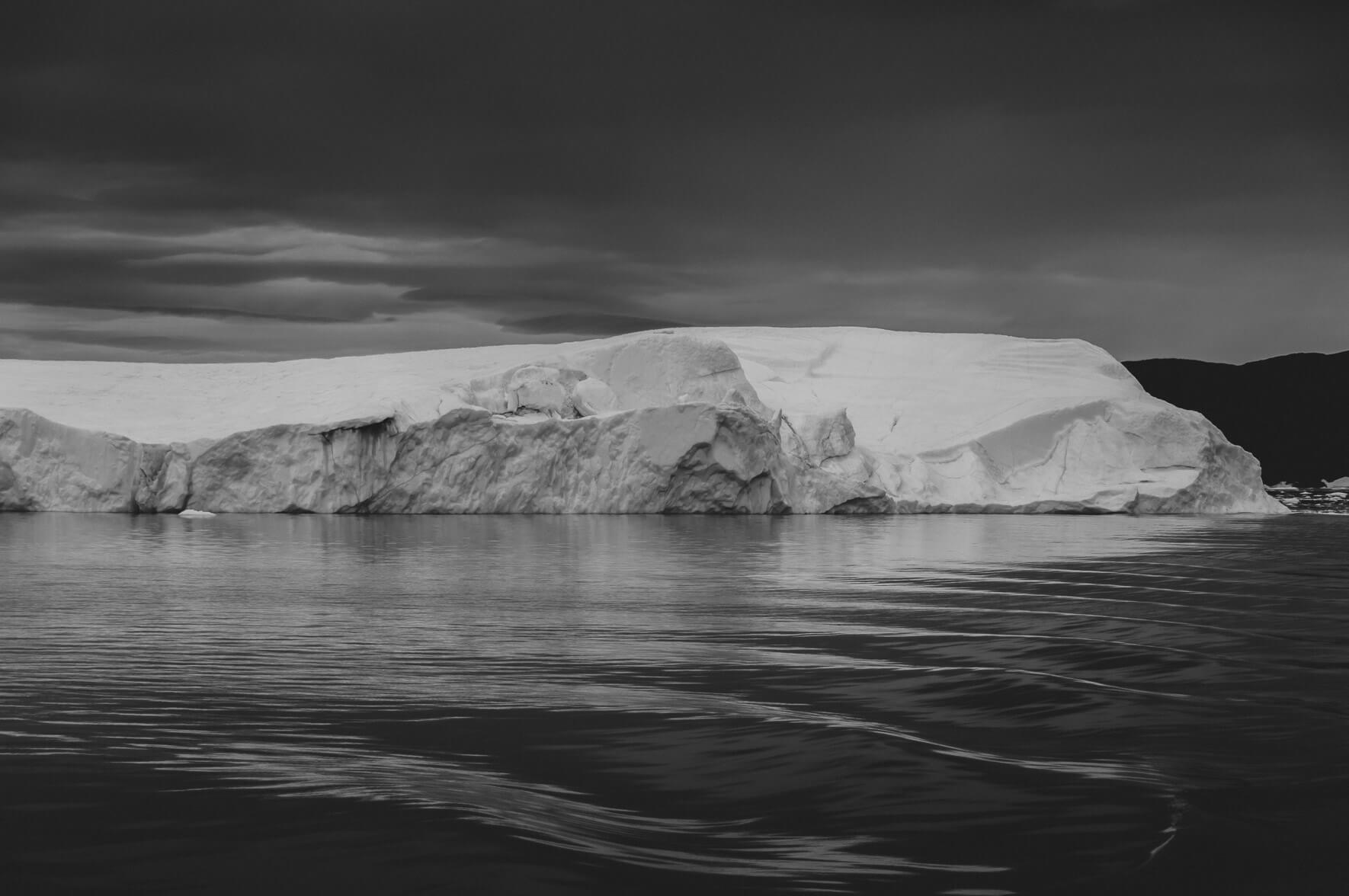 Iceberg and soft waves in black and white (Greenland)